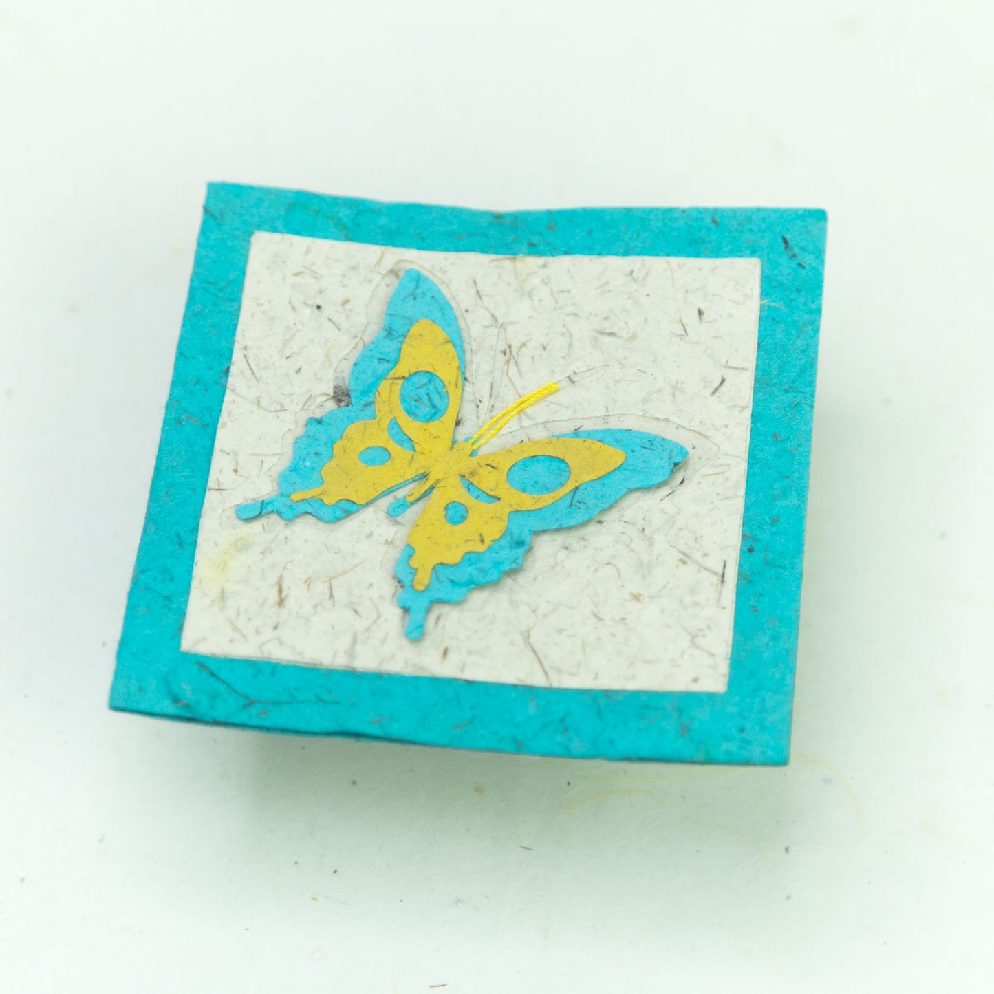 flower garden themed eco-friendly greeting card with a butterfly in teal and natural close up