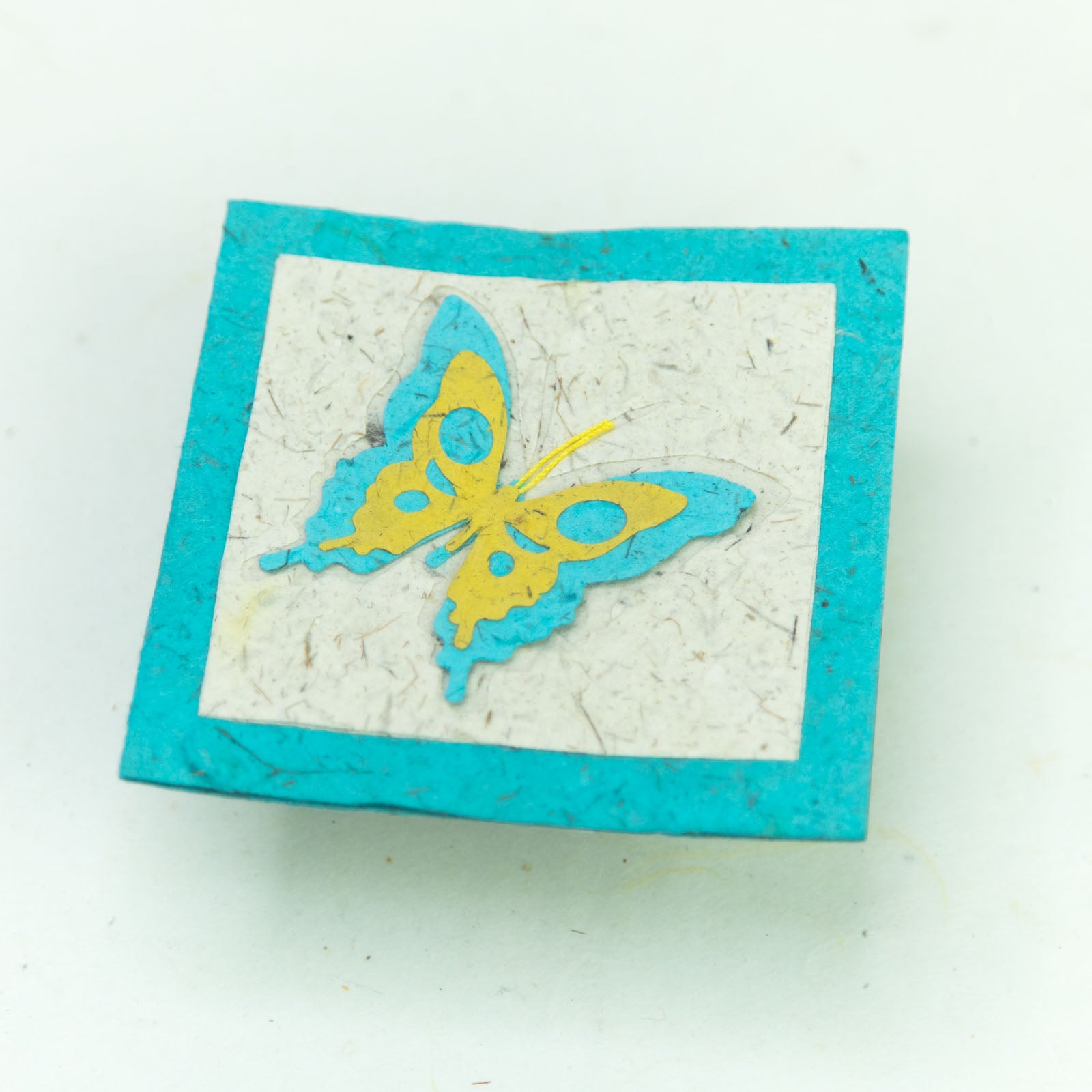 flower garden themed eco-friendly greeting card with a butterfly in teal and natural close up