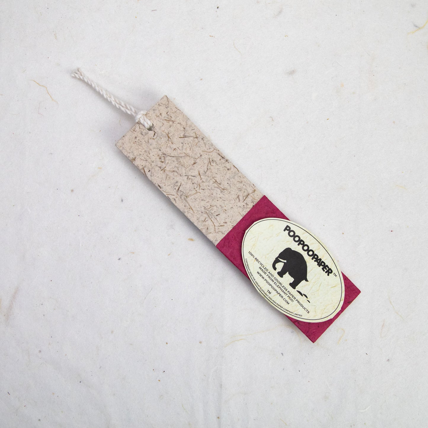 front of red paper bookmark from poopoopaper