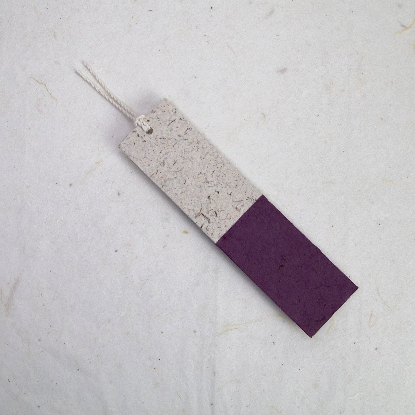 back of purple paper bookmark from poopoopaper