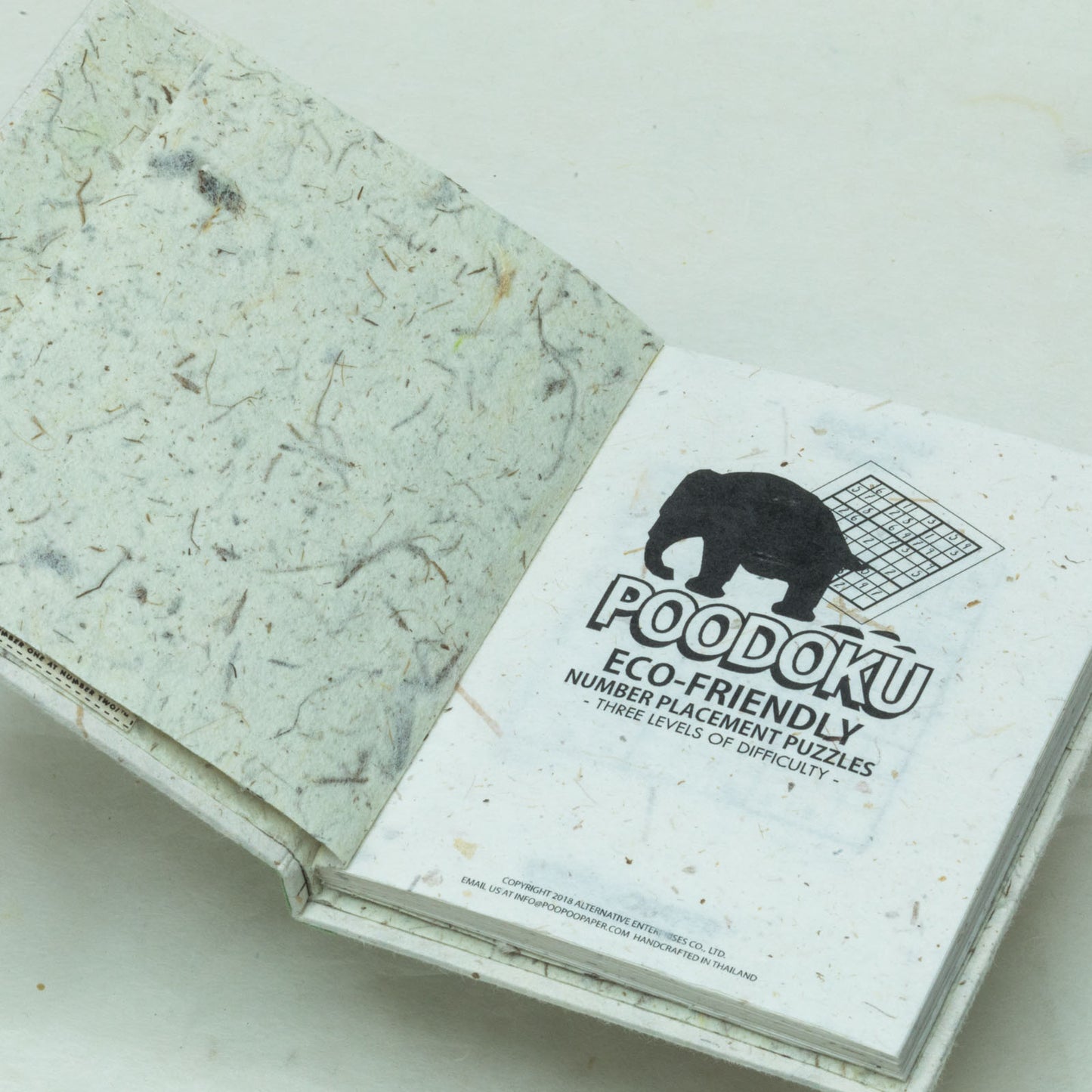 Poodoku - Three Volume Sudoku Number Placement Puzzle Set - Inside first page of sustainable product