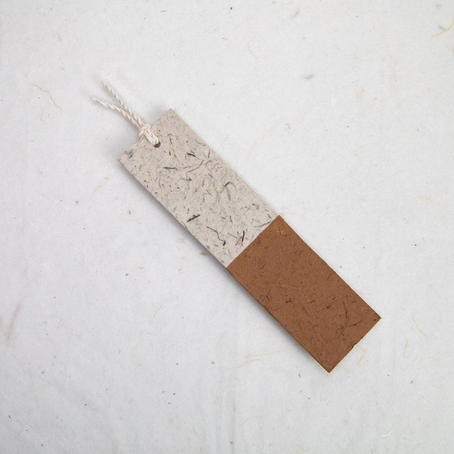 back of brown paper bookmark from poopoopaper