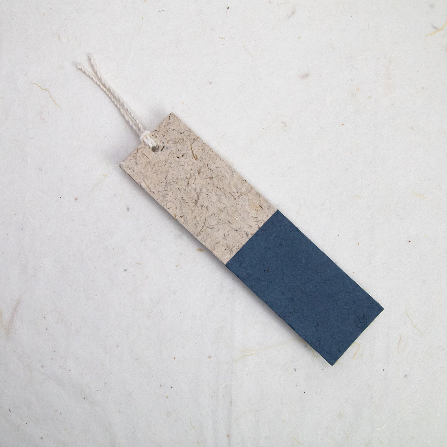 back of blue paper bookmark from poopoopaper