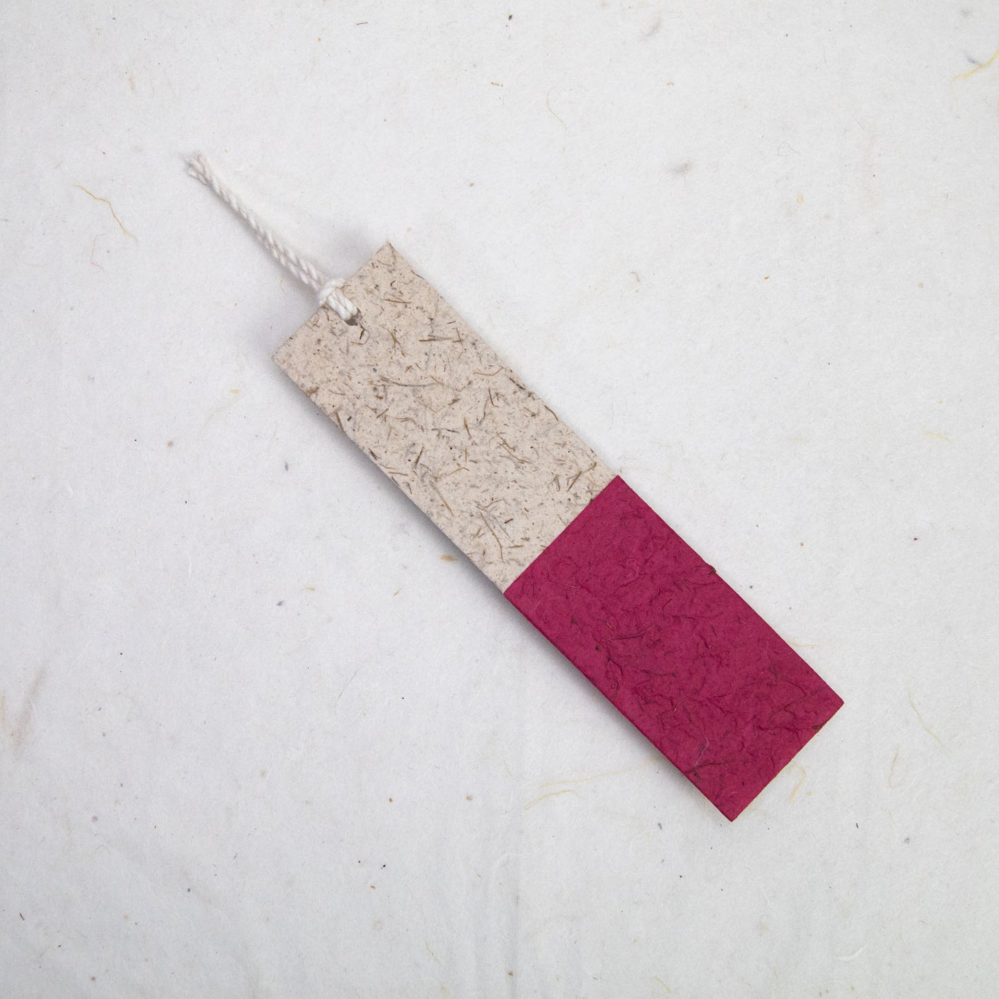 back of red paper bookmark from poopoopaper