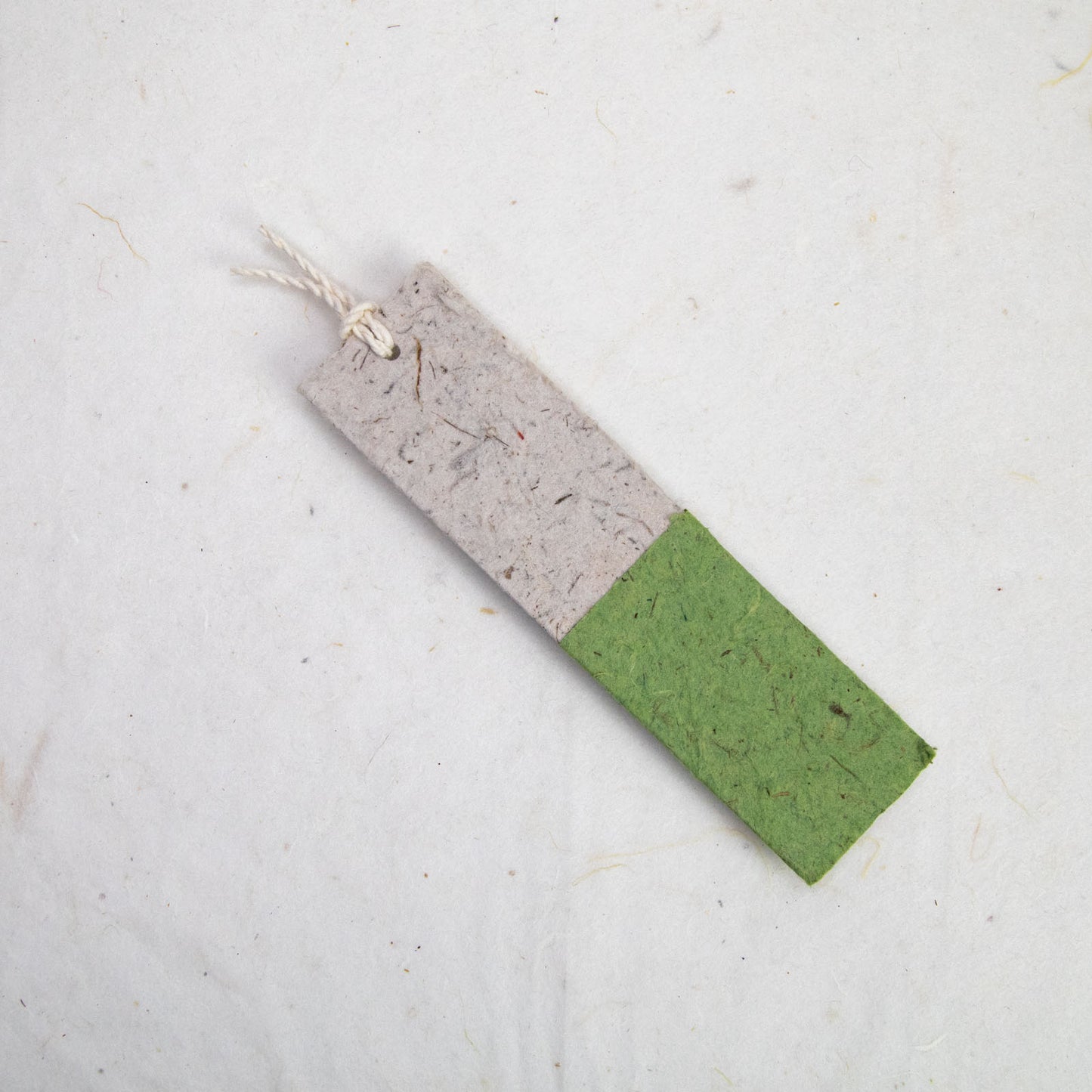 back of green paper bookmark from poopoopaper