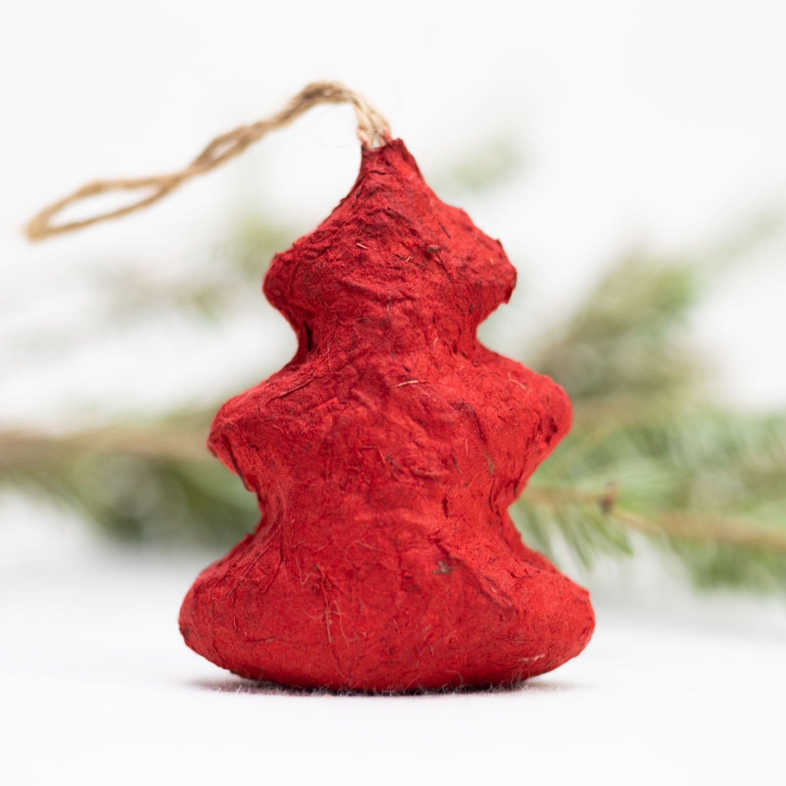 eco-friendly ornaments shaped like christmas trees in red